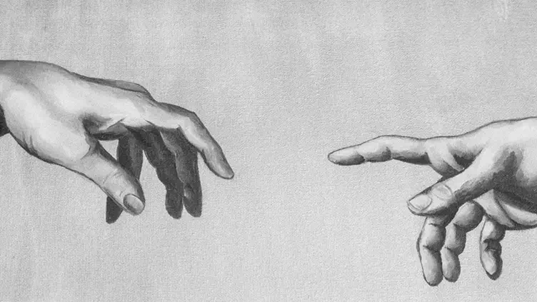 Zwei Hände, die sich einander annähern - ein Symbol für menschliche Würde, Verbindung und Mitgefühl